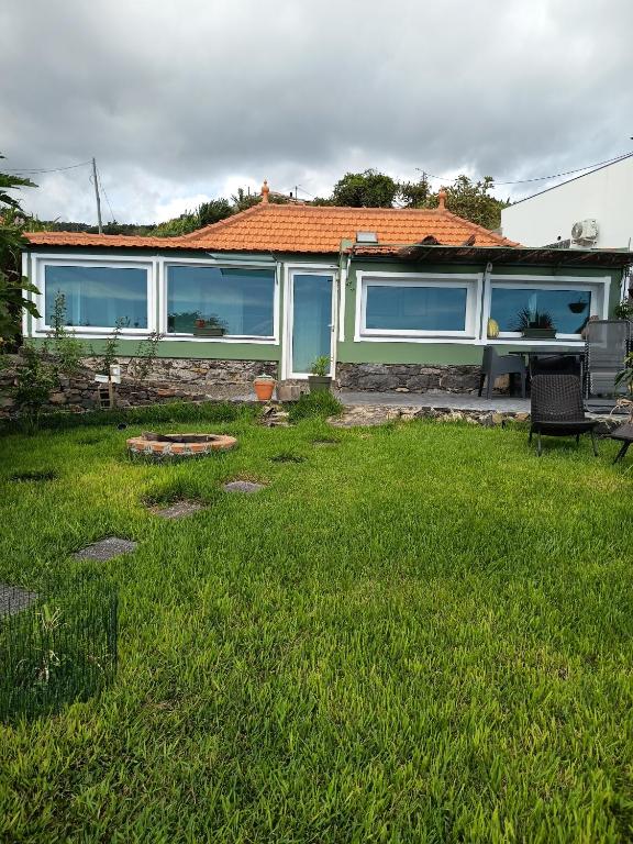 Exterior with garden and orange-tiled roof