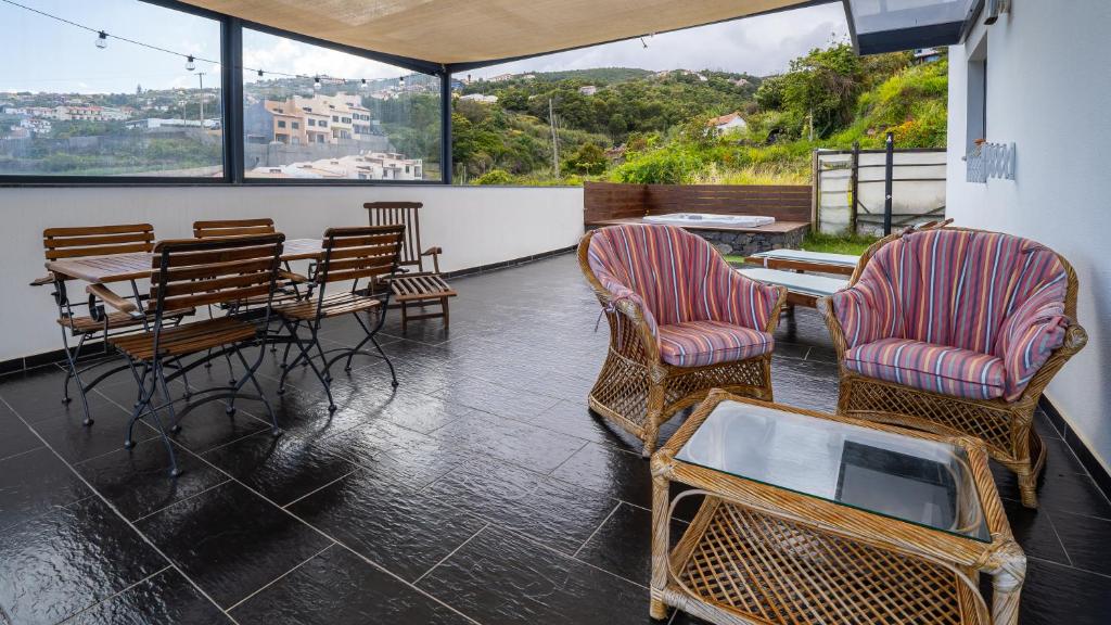 Terrace with dining table and lounge seating